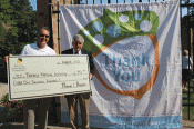 Erie Gives Checks Presented